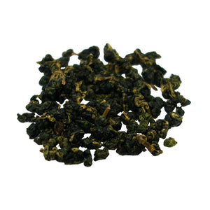 Dah Yeh Green Tea whole tea leaves on white surface