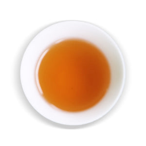 overhead view of white cup with  hualien honey tea inside