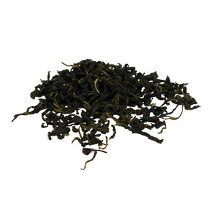 Jinxuan Green Tea whole tea leaves on white surface