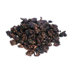 Luyeh Red Oolong whole tea leaves on white surface
