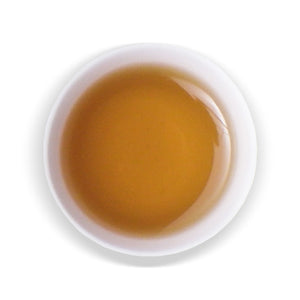 overhead view of white cup with Luyeh Red Oolong tea inside