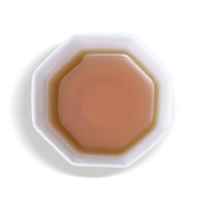 overhead view of white cup with  Sun Moon Lake Red Jade tea inside